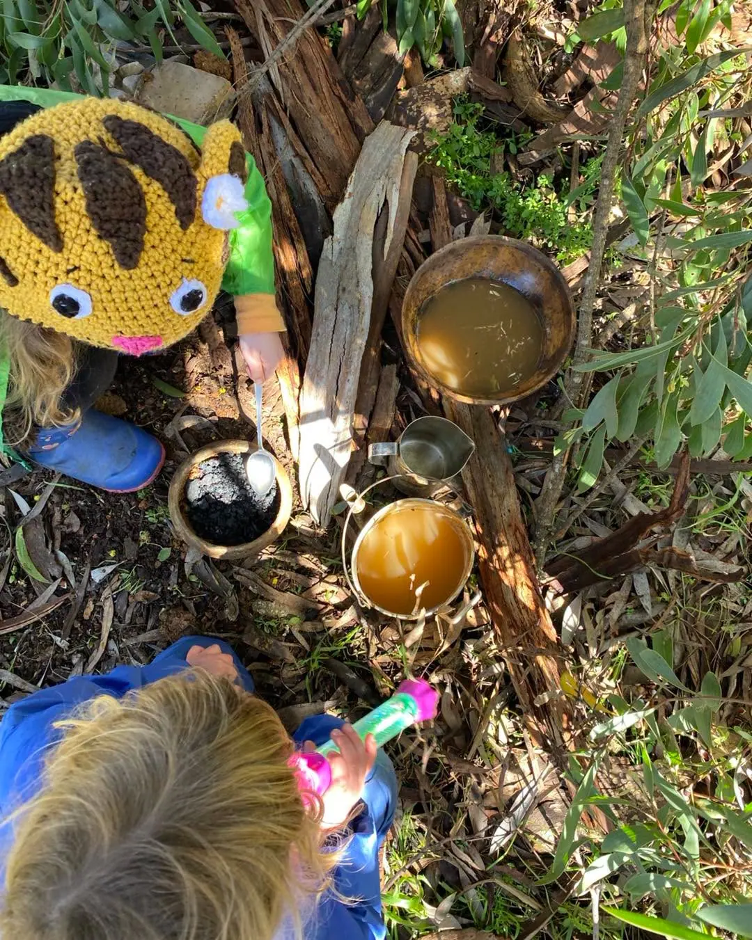 Children learning together during a practical outdoor session